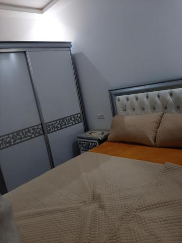 Ένα ή περισσότερα κρεβάτια σε δωμάτιο στο Location vacance M'diq Tetouan