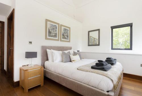 Postel nebo postele na pokoji v ubytování Wassell Barn