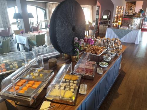 a buffet line with many different types of food at Boutique Hotel Vivenda Miranda in Lagos