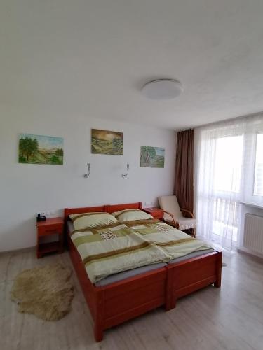 a bedroom with a large bed in a room at Ružová Vila in Banská Štiavnica