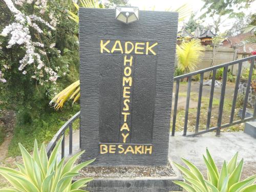 a sign that says kabb activation on a fence at Kadek Homestay in Besakih