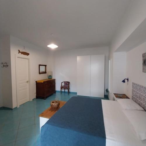 A bed or beds in a room at La Casa Di Massimiliano - Villa del Sole