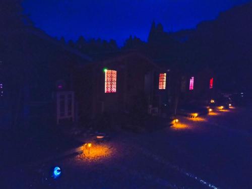 a group of lit up lights in the dark at 星逢える宿ー森のコテージ気仙沼 in Kesennuma