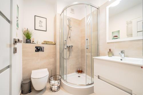 a bathroom with a shower and a toilet and a sink at Central Athena Studio - Inima Pieței Unirii - By OpenHouse apartments in Timişoara