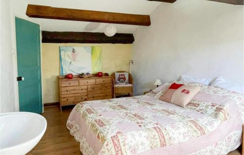 a bedroom with a bed and a bathroom with a sink at Nice Home In Escales With House A Panoramic View in Escales