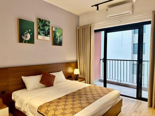 Ένα ή περισσότερα κρεβάτια σε δωμάτιο στο Luxe Paradise Residence 88 Tu Hoa