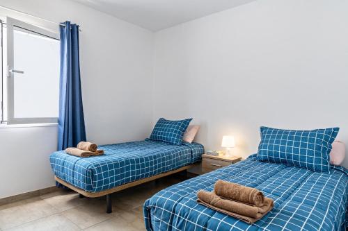 Postel nebo postele na pokoji v ubytování Barlovento Apartment