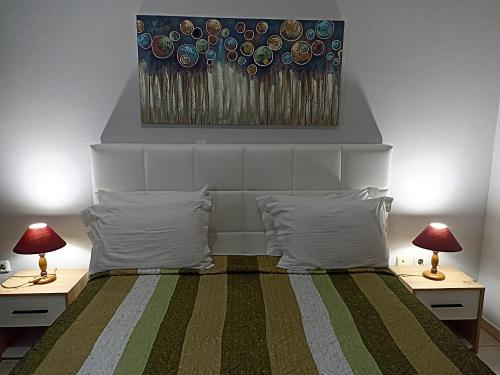 Postel nebo postele na pokoji v ubytování Evangelia