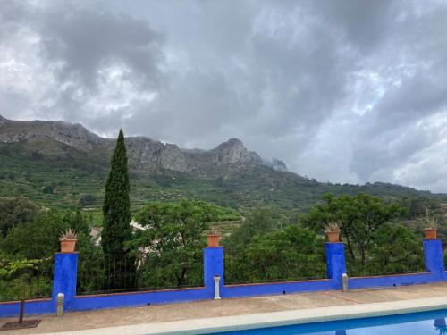 a view of the mountains from a swimming pool at Casa Gallinera in Benissiva