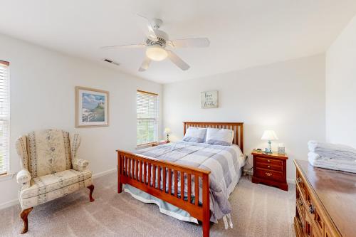a bedroom with a bed and a ceiling fan at Creekside --- 57 Tributary Lane in Millville