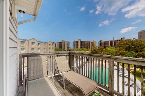 a balcony with a chair sitting on top of it at Bethany Beach Inn - 39634 Jefferson Bridge Rd #201 in Bethany Beach