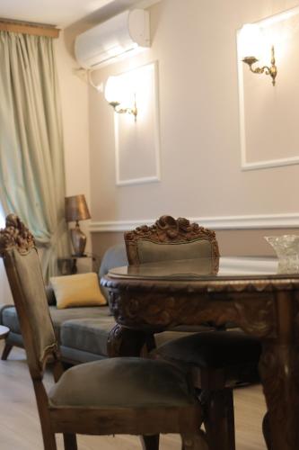 a living room with a table and a couch at ZARO Apartments in Bitola