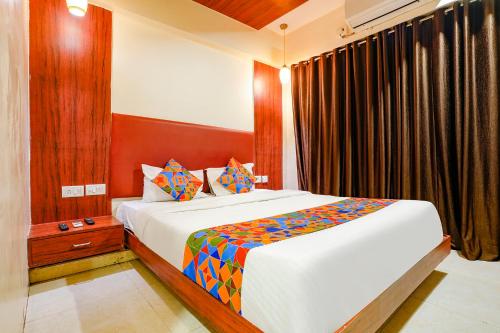 a bedroom with a large bed in a room at Hotel D69 Residency in Mire