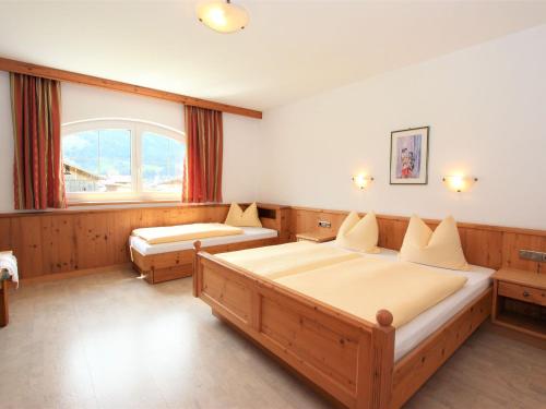A bed or beds in a room at Apartment Monika-1 by Interhome
