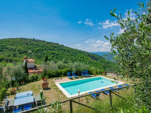 a villa with a swimming pool and a mountain at Holiday Home L'Amorosa by Interhome in Monsummano