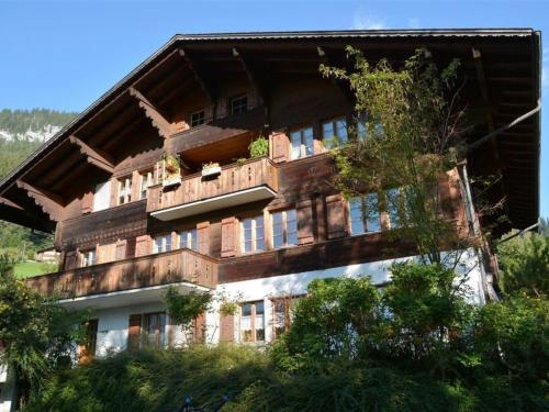 a large building with a balcony on top of it at Apartment Akelei - gross by Interhome in Zweisimmen