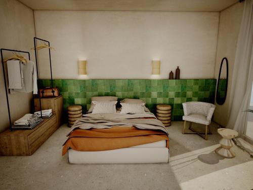 a bedroom with a bed and a green tiled wall at Sirene Blue Luxury Beach Resort in Poros