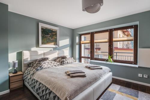 Posteľ alebo postele v izbe v ubytovaní Apartament w Centrum Szczawnicy
