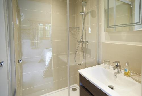 a bathroom with a shower and a sink at The Loft in South Stoke