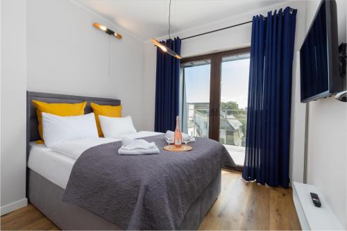 Gulta vai gultas numurā naktsmītnē Kormoran Apartment with AC by Renters Prestige