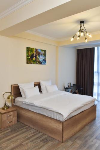 a bedroom with a large bed in a room at Altunyan Hotel in Yerevan