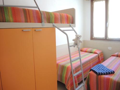 A bed or beds in a room at Colorful modern flat next to the beach - Beahost