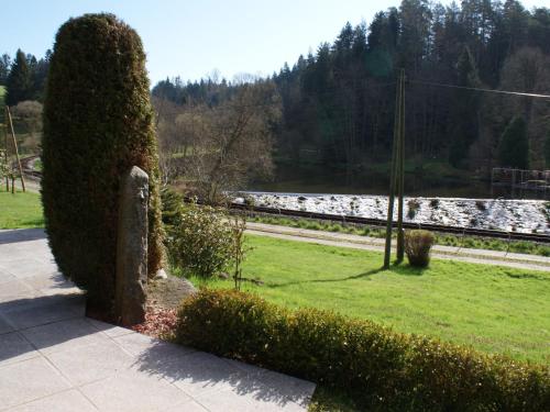 a bush sitting on the side of a sidewalk at Holiday Home Reiter by Interhome in Rohrbach