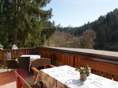 a patio with tables and chairs on a deck at Holiday Home Reiter by Interhome in Rohrbach