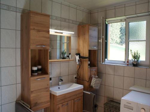 a bathroom with a sink and a mirror at Holiday Home Reiter by Interhome in Rohrbach