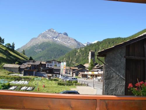 a view of a town with a mountain in the background at Apartment Wiedersehen by Interhome in Saas-Grund
