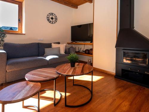 a living room with two tables and a couch at Apartment Peak by Interhome in Taüll
