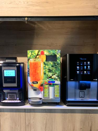 a shelf with a blender and a microwave on it at Turia Valencia in Valencia