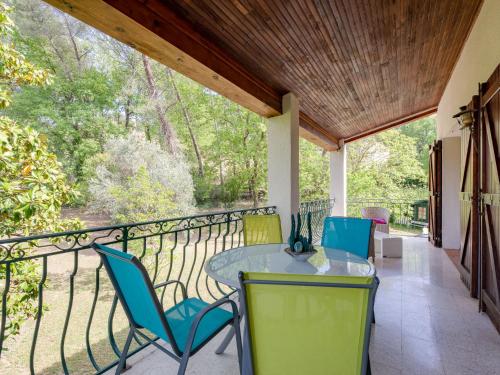 a porch with chairs and a table on a balcony at Apartment Villa Manon by Interhome in Mouans-Sartoux