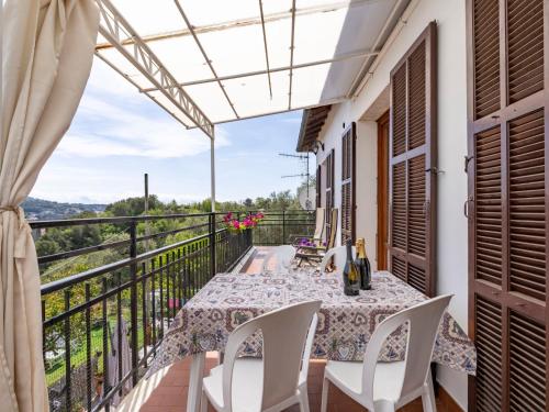 a balcony with a table and chairs and a view at Apartment Relax by Interhome in Marina di Andora