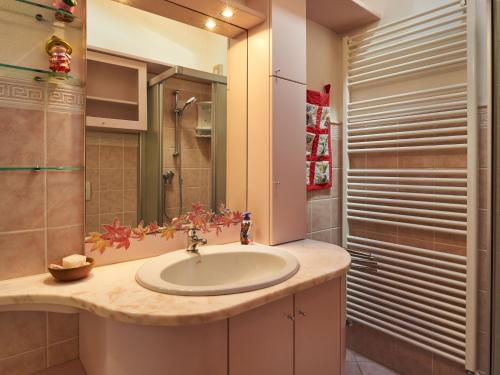 a bathroom with a sink and a shower at Holiday Home Casa Grandola-Green Garden by Interhome in Naggio