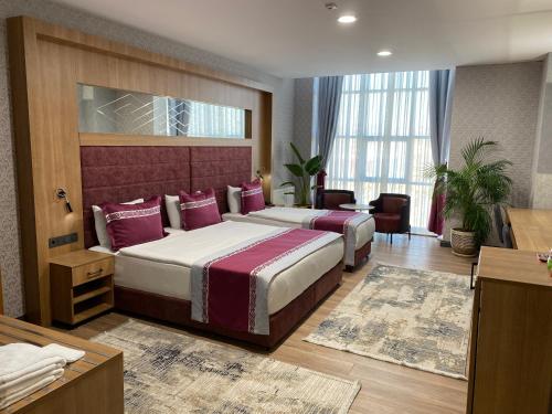 Postel nebo postele na pokoji v ubytování Lavanta Tepesi Hotel ve Spor Tesisleri