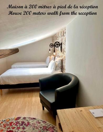 a bedroom with a bed and a couch and a chair at Le Clos Violette et Le 11 D'Aglaé - Hôtel de Charme Design de Luxe in LʼIsle-sur-la-Sorgue
