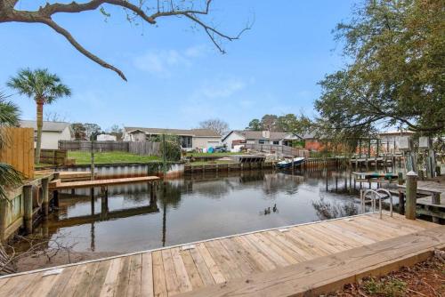a view of a river with a dock at Gulf Brz-Beaches-Dwntwn PNS-Pet Friendly-Canal in Gulf Breeze