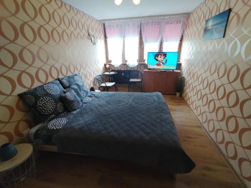 Posteľ alebo postele v izbe v ubytovaní Mieszkanie Jelenia