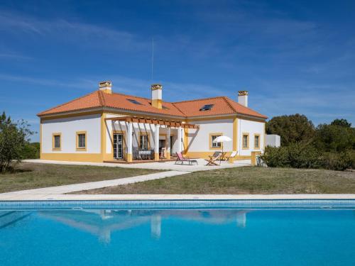 a house with a swimming pool in front of it at Holiday Home Vista Panorâmica- Herdade de Montalvo by Interhome in Alcácer do Sal