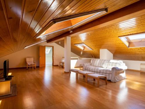 a living room with a couch and a tv at Holiday Home Vista Panorâmica- Herdade de Montalvo by Interhome in Alcácer do Sal
