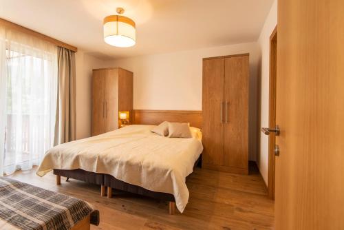 Ένα ή περισσότερα κρεβάτια σε δωμάτιο στο Apartment Dorf Wagrain Alpenleben by AlpenTravel