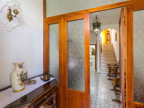 a living room with a table and a mirror at Holiday Home A casa di Gabri by Interhome in Montefollonico