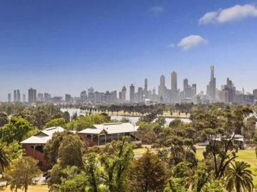 a view of a city skyline from a park at Large Two Bedroom Apartment with City Park and Bay views in Melbourne