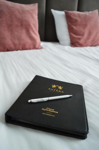 Ένα ή περισσότερα κρεβάτια σε δωμάτιο στο Hotel Estera