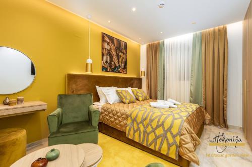 a hotel room with a bed and a chair at Hotel Vila Hedonija in Herceg-Novi