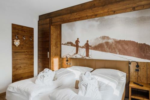 Letto o letti in una camera di Family Hotel Gran Baita