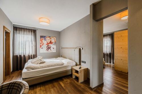 Letto o letti in una camera di Family Hotel Gran Baita