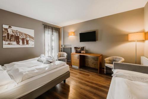 Letto o letti in una camera di Family Hotel Gran Baita