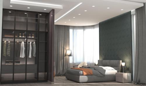 a living room with a couch and a closet at VIP Nizami EMIRATES in Baku